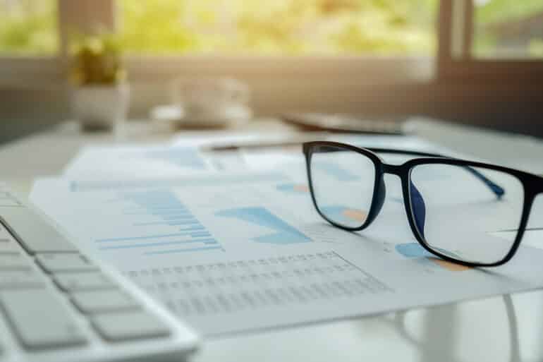 business-concept-with-copy-space-office-desk-table-with-pen-focus-analysis-chart-computer-notebook-cup-coffee-desk-vintage-tone-retro-filter-selective-focus business concept with copy space office desk table with pen focus analysis chart computer notebook cup coffee desk vintage tone retro filter selective focus